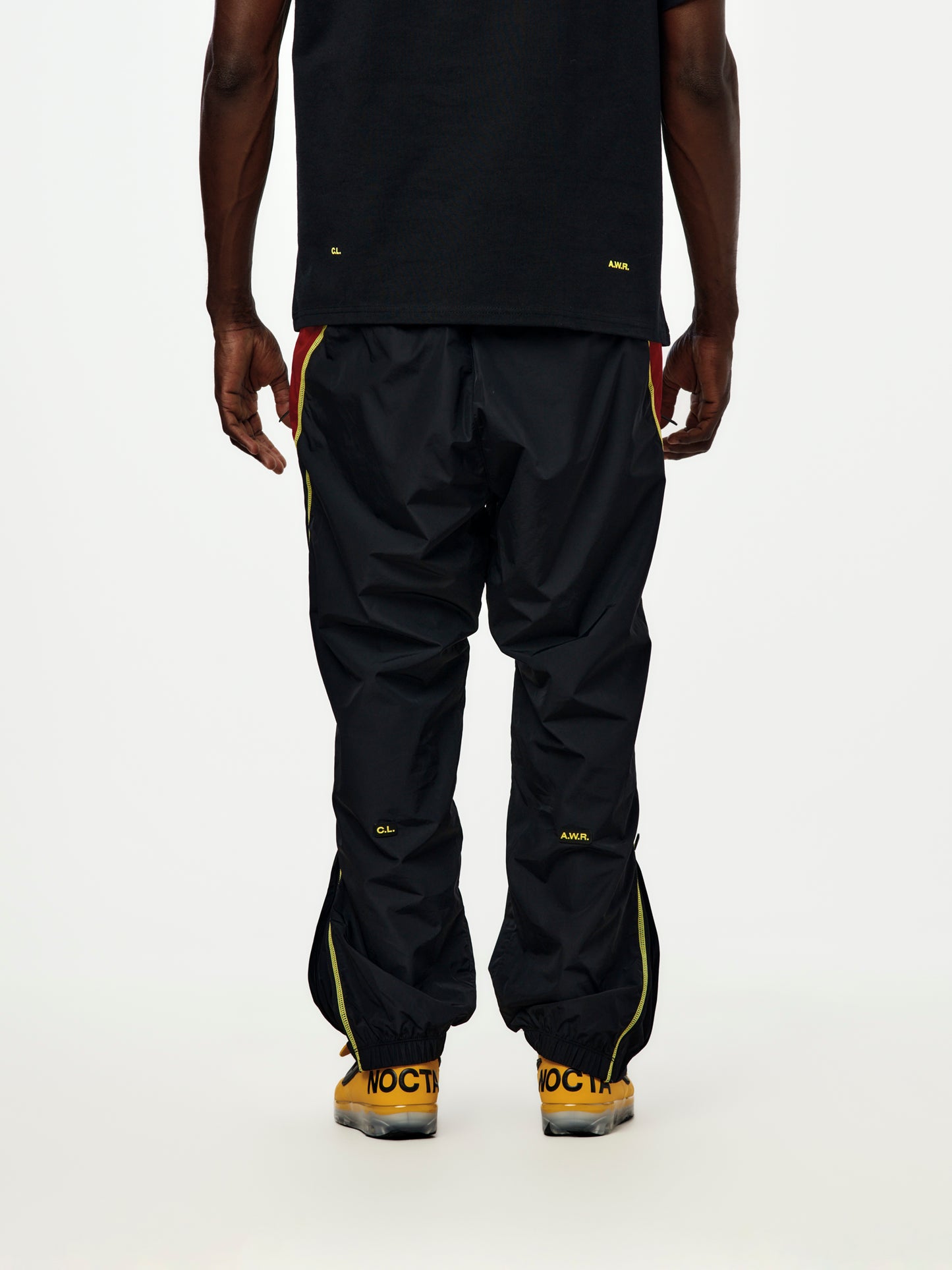 Canada x NOCTA x Nike Woven Track Pants (Black/Gym Red/Sonic Yellow/Sonic Yellow)