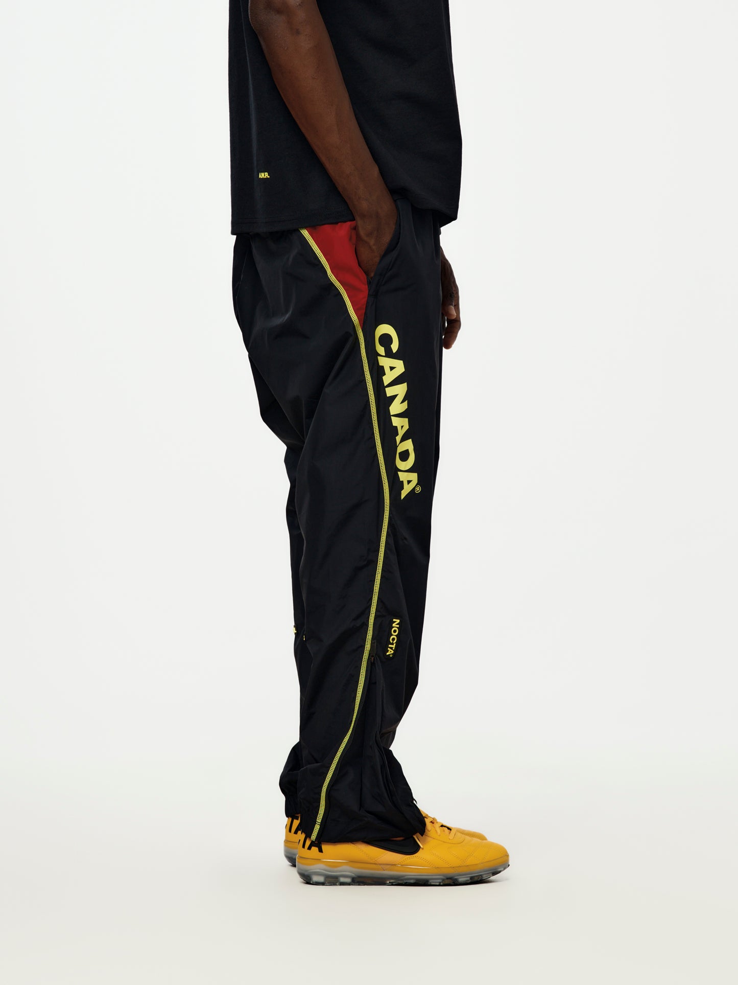 Canada x NOCTA x Nike Woven Track Pants (Black/Gym Red/Sonic Yellow/Sonic Yellow)