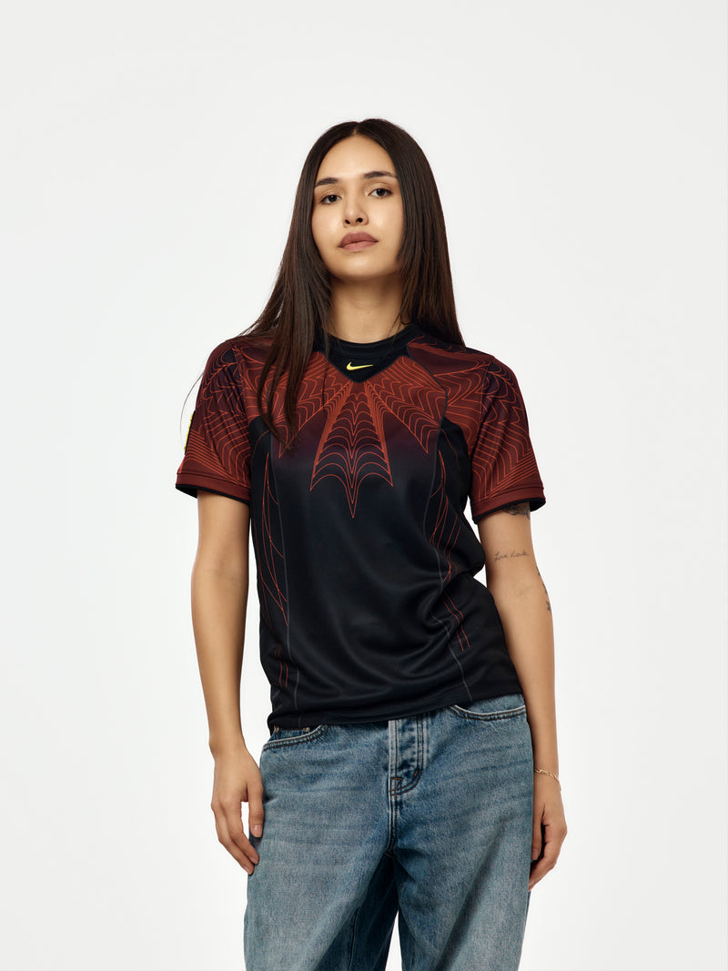 Canada x NOCTA x Nike Youth Dri-Fit Soccer Pre-Match Short-Sleeve Top (Black/University Red/Sonic Yellow)