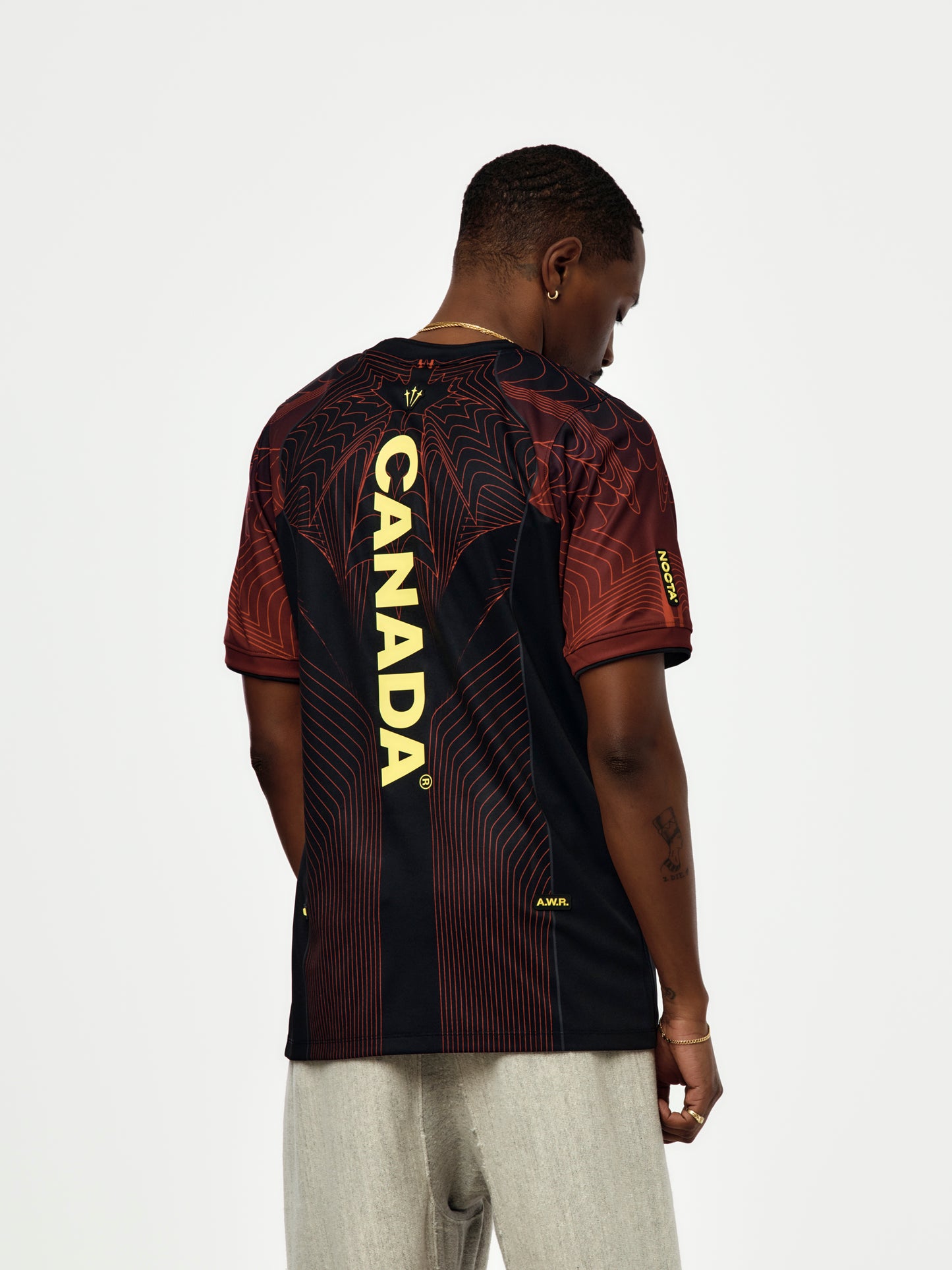 NOCTA X CANADA NIKE JERSEY (BLACK/UNIVERSITY RED/SONIC YELLOW)